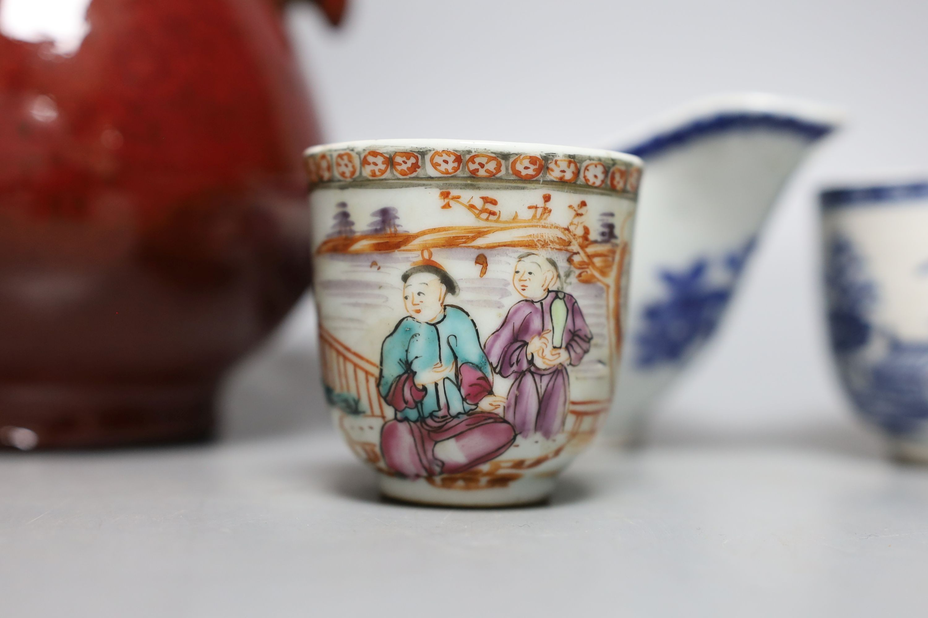 An 18th century Chinese export tea cup, 3 pieces of export blue and white and a sang de boeuf vase. Tallest 16cm